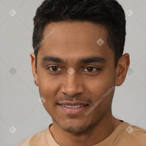 Joyful latino young-adult male with short  brown hair and brown eyes