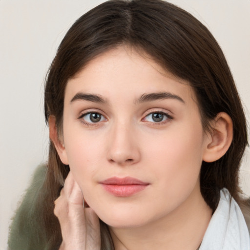 Neutral white young-adult female with medium  brown hair and brown eyes