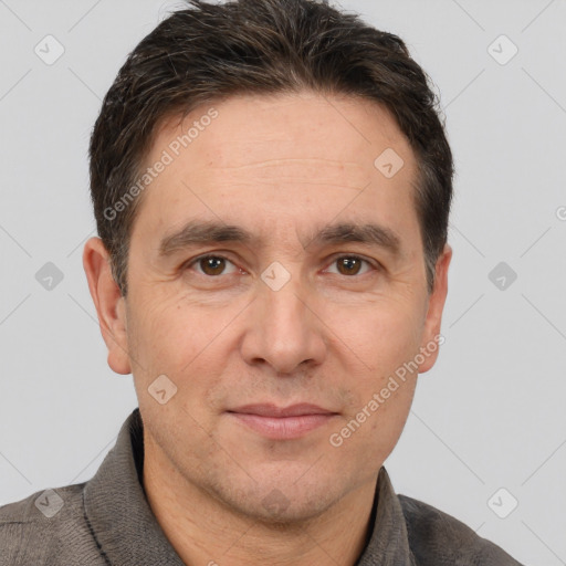 Joyful white adult male with short  brown hair and brown eyes