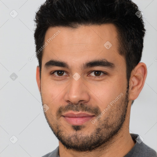 Joyful white young-adult male with short  black hair and brown eyes