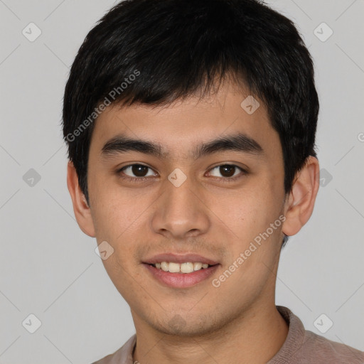 Joyful white young-adult male with short  black hair and brown eyes