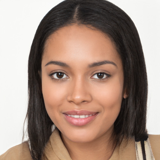 Joyful latino young-adult female with long  black hair and brown eyes