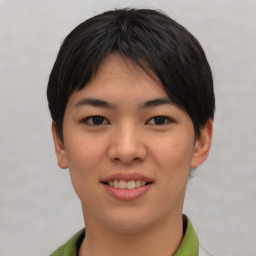 Joyful asian young-adult female with short  brown hair and brown eyes