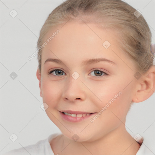 Joyful white child female with short  brown hair and brown eyes