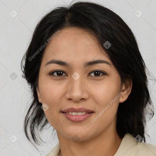 Joyful latino young-adult female with medium  brown hair and brown eyes