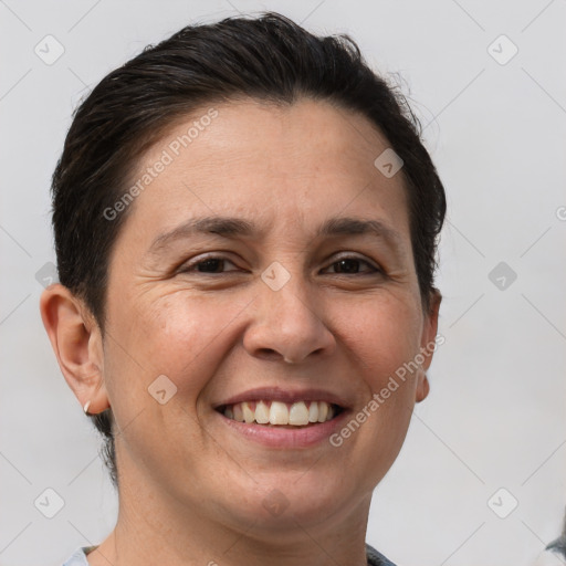 Joyful white adult female with short  brown hair and brown eyes