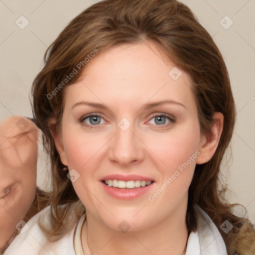 Joyful white young-adult female with medium  brown hair and blue eyes