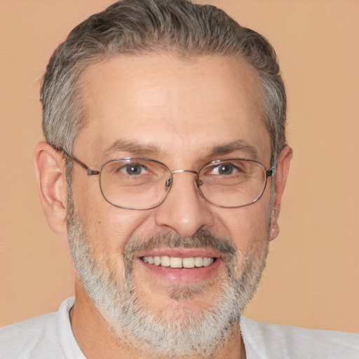 Joyful white middle-aged male with short  gray hair and brown eyes