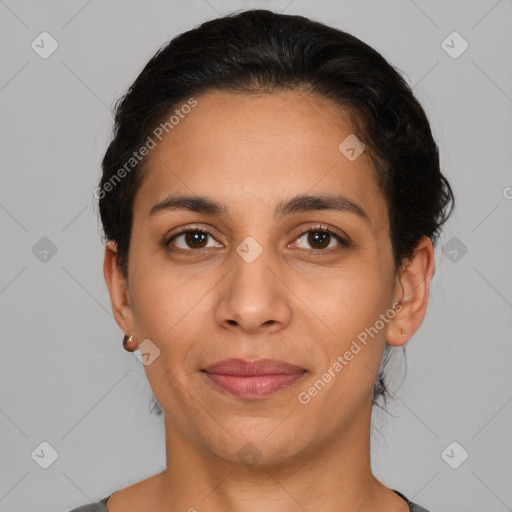 Joyful latino young-adult female with short  brown hair and brown eyes