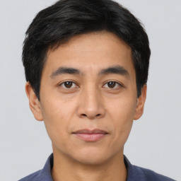 Neutral white young-adult male with short  black hair and brown eyes