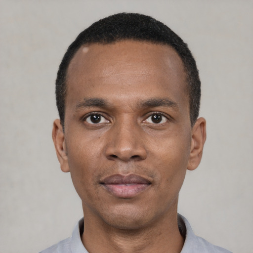 Neutral black young-adult male with short  black hair and brown eyes
