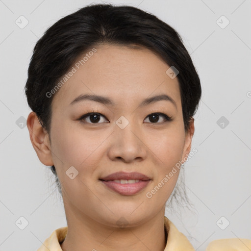 Joyful asian young-adult female with short  brown hair and brown eyes