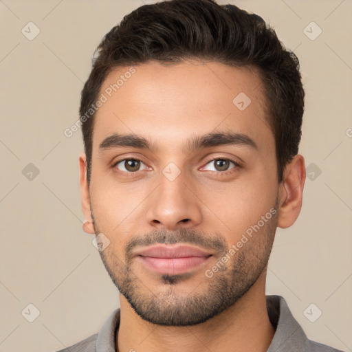 Joyful white young-adult male with short  brown hair and brown eyes