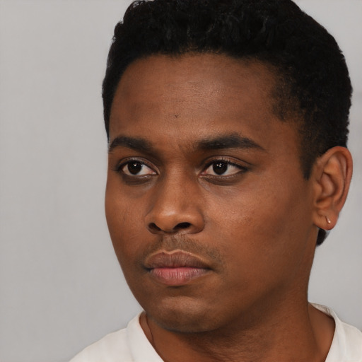 Neutral black young-adult male with short  black hair and brown eyes