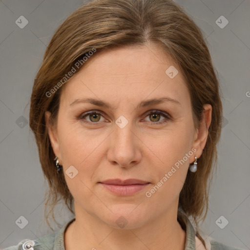 Joyful white adult female with medium  brown hair and grey eyes