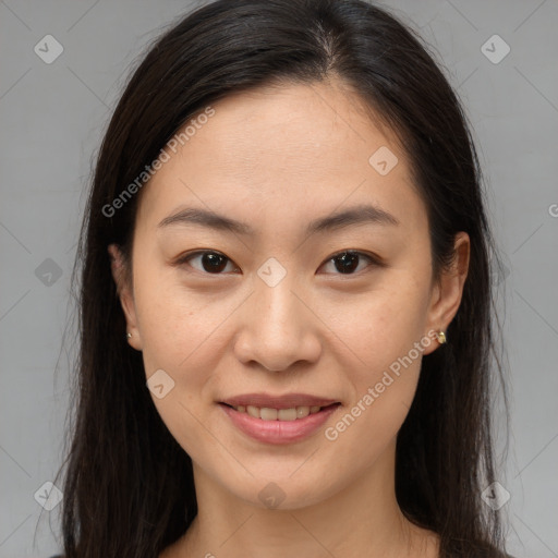 Joyful asian young-adult female with long  brown hair and brown eyes