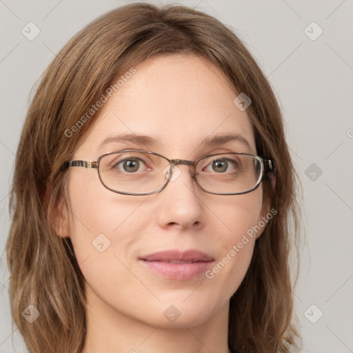 Joyful white young-adult female with long  brown hair and green eyes