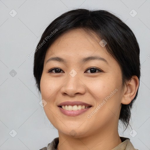 Joyful asian young-adult female with medium  brown hair and brown eyes