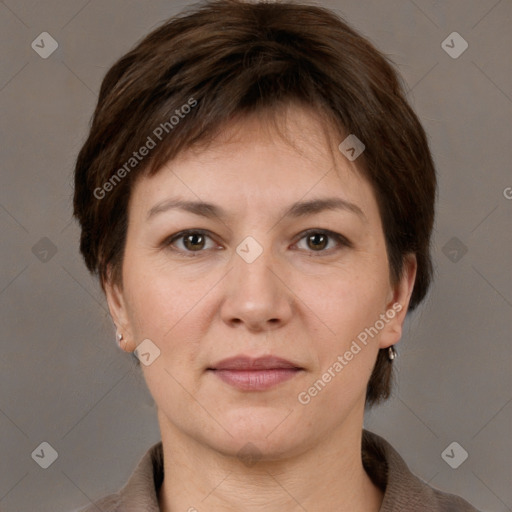 Joyful white adult female with short  brown hair and grey eyes