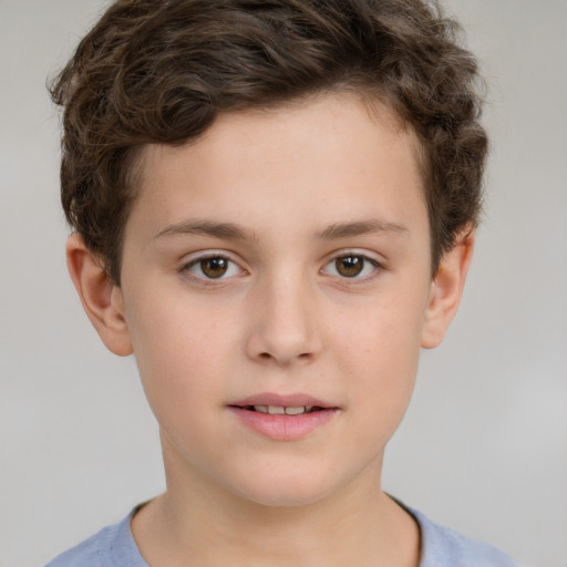 Joyful white child male with short  brown hair and brown eyes