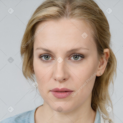 Joyful white young-adult female with medium  brown hair and blue eyes