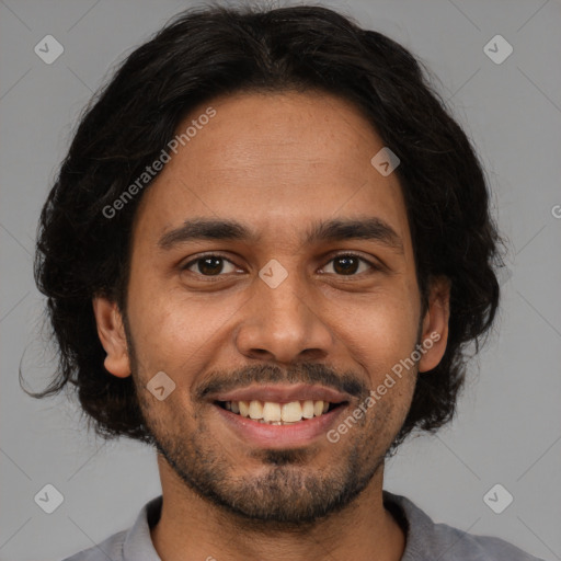 Joyful white young-adult male with short  black hair and brown eyes