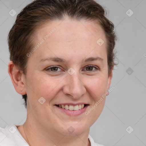 Joyful white young-adult female with short  brown hair and grey eyes