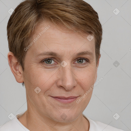 Joyful white adult female with short  brown hair and grey eyes