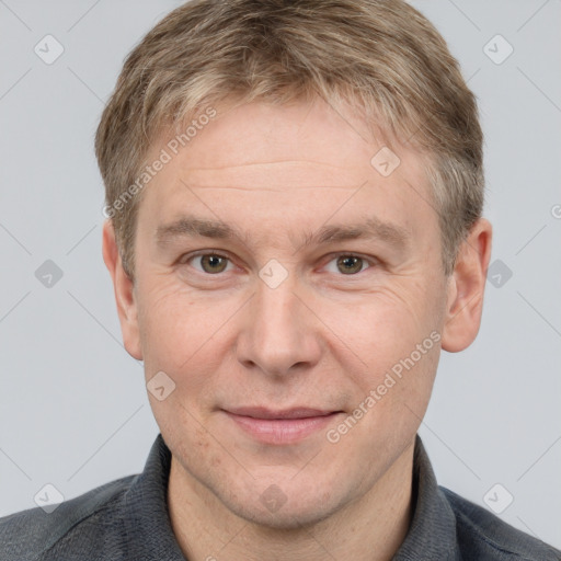 Joyful white adult male with short  brown hair and grey eyes