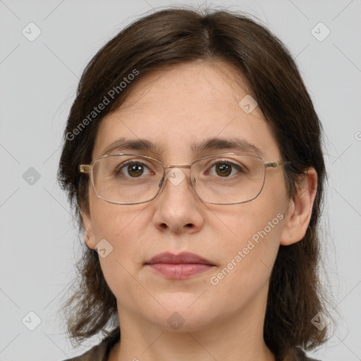 Joyful white adult female with medium  brown hair and grey eyes