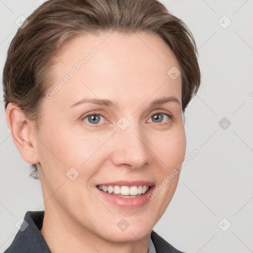 Joyful white young-adult female with short  brown hair and grey eyes