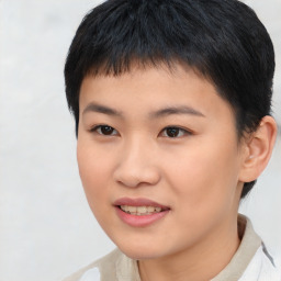 Joyful asian young-adult female with short  black hair and brown eyes