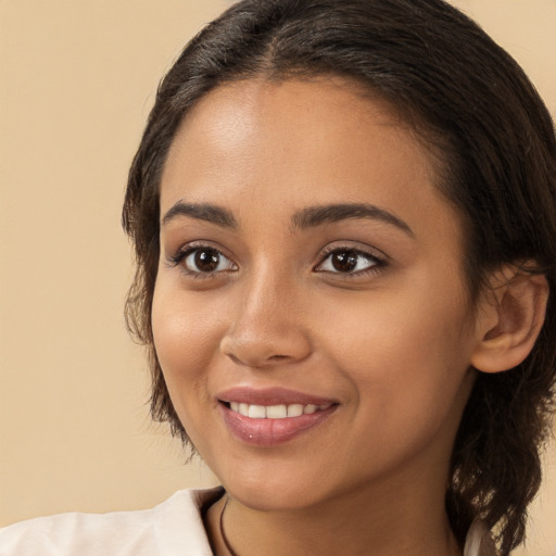 Joyful white young-adult female with medium  brown hair and brown eyes