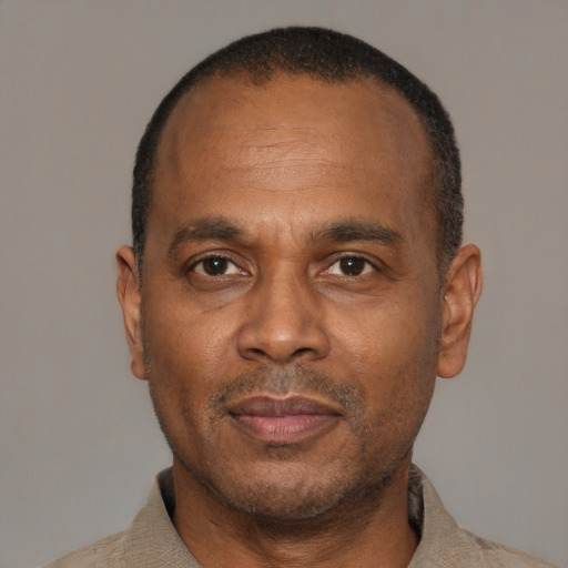 Neutral latino adult male with short  black hair and brown eyes