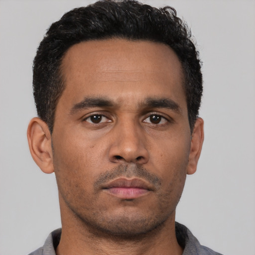 Neutral latino young-adult male with short  brown hair and brown eyes