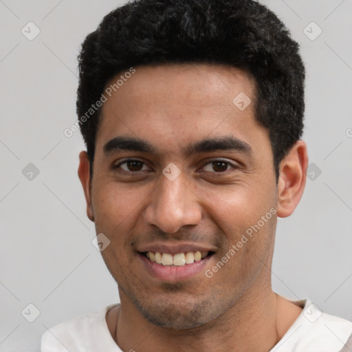 Joyful white young-adult male with short  black hair and brown eyes