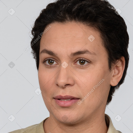 Joyful white adult female with short  brown hair and brown eyes