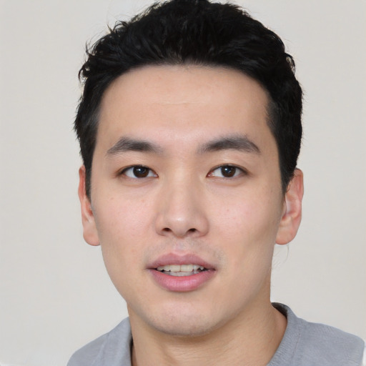 Neutral asian young-adult male with short  black hair and brown eyes
