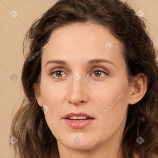 Joyful white young-adult female with long  brown hair and green eyes