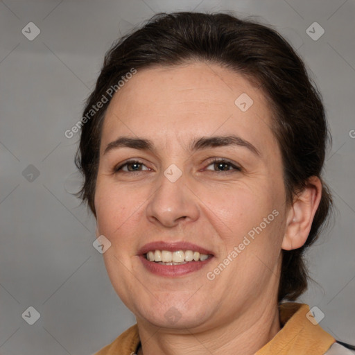 Joyful white adult female with medium  brown hair and brown eyes