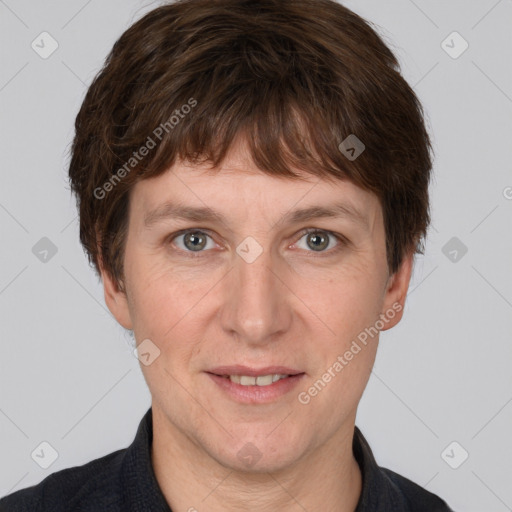 Joyful white adult male with short  brown hair and grey eyes