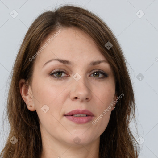 Joyful white adult female with long  brown hair and grey eyes