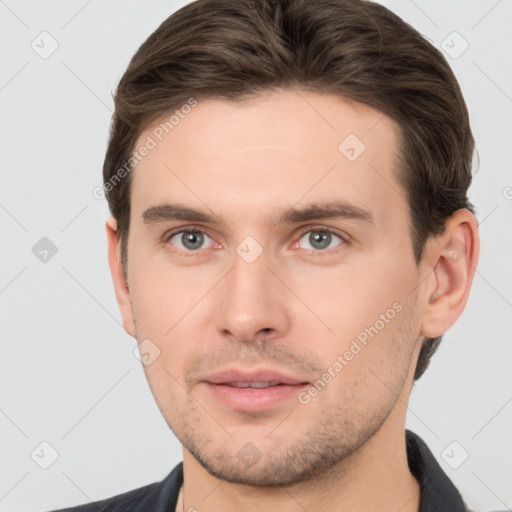 Neutral white young-adult male with short  brown hair and brown eyes