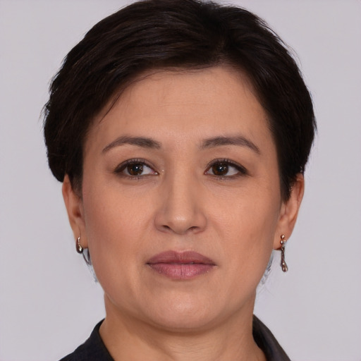 Joyful asian adult female with short  brown hair and brown eyes