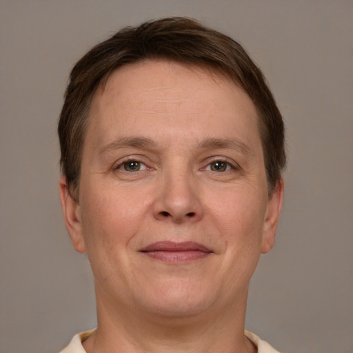 Joyful white adult female with short  brown hair and brown eyes