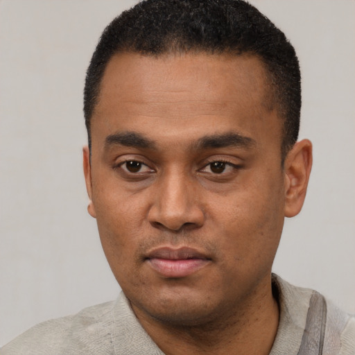 Neutral latino young-adult male with short  black hair and brown eyes
