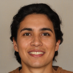 Joyful white young-adult male with medium  brown hair and brown eyes