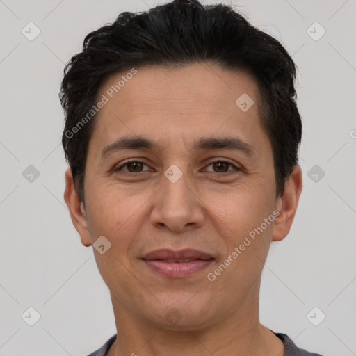 Joyful white adult male with short  black hair and brown eyes