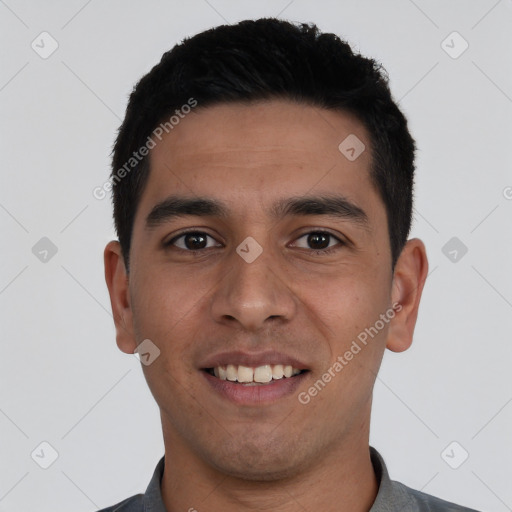 Joyful white young-adult male with short  black hair and brown eyes