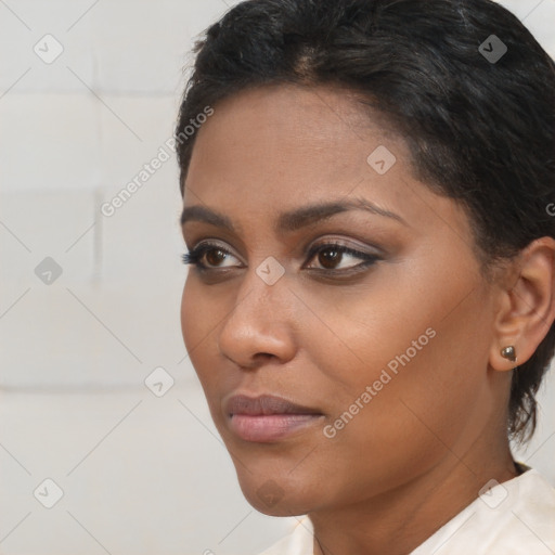 Neutral black young-adult female with medium  brown hair and brown eyes